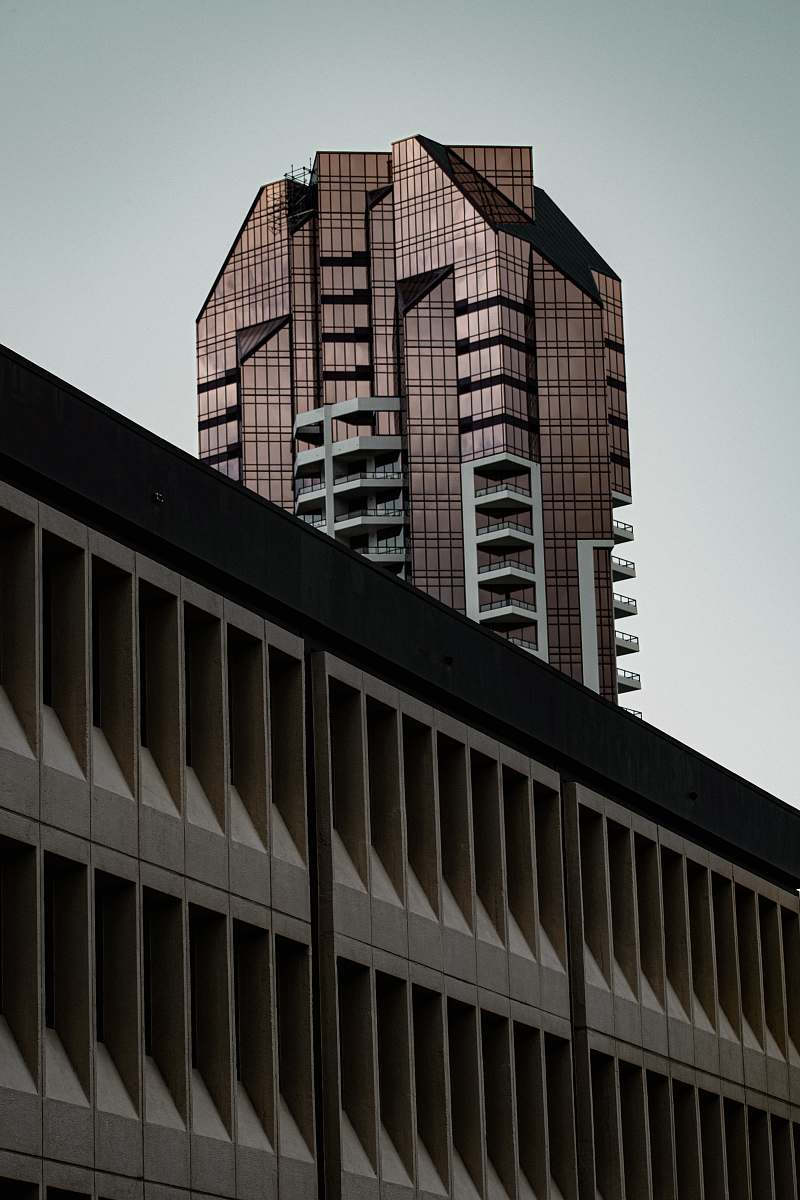 office building brown high rise building banister